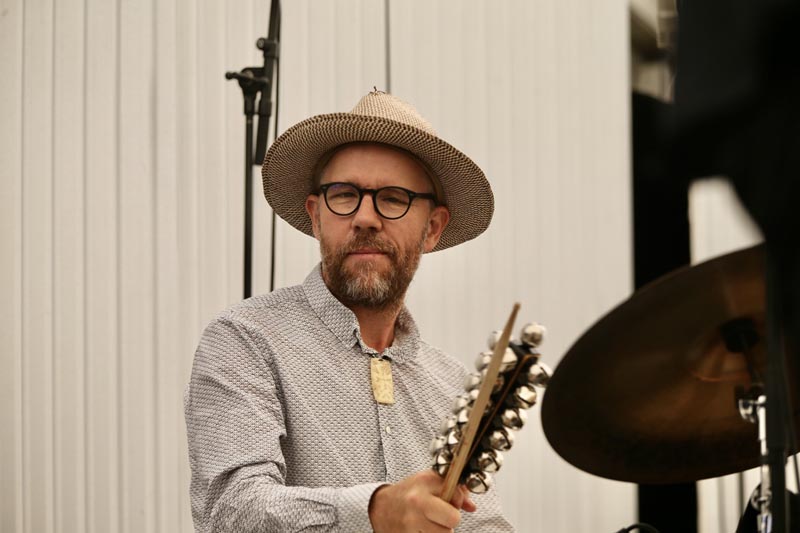 A close-up image of Chris O'Connor playing drums